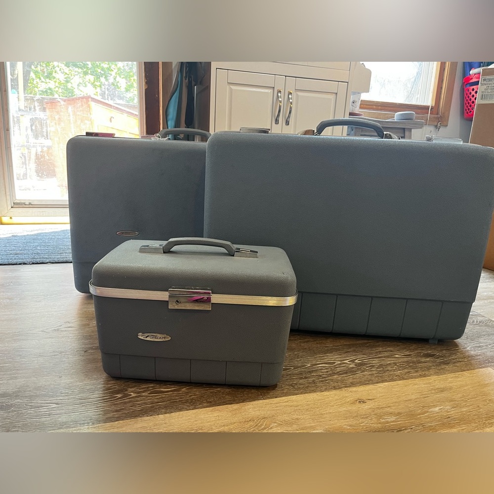 Light blue and silver vintage Forecast luggage set.